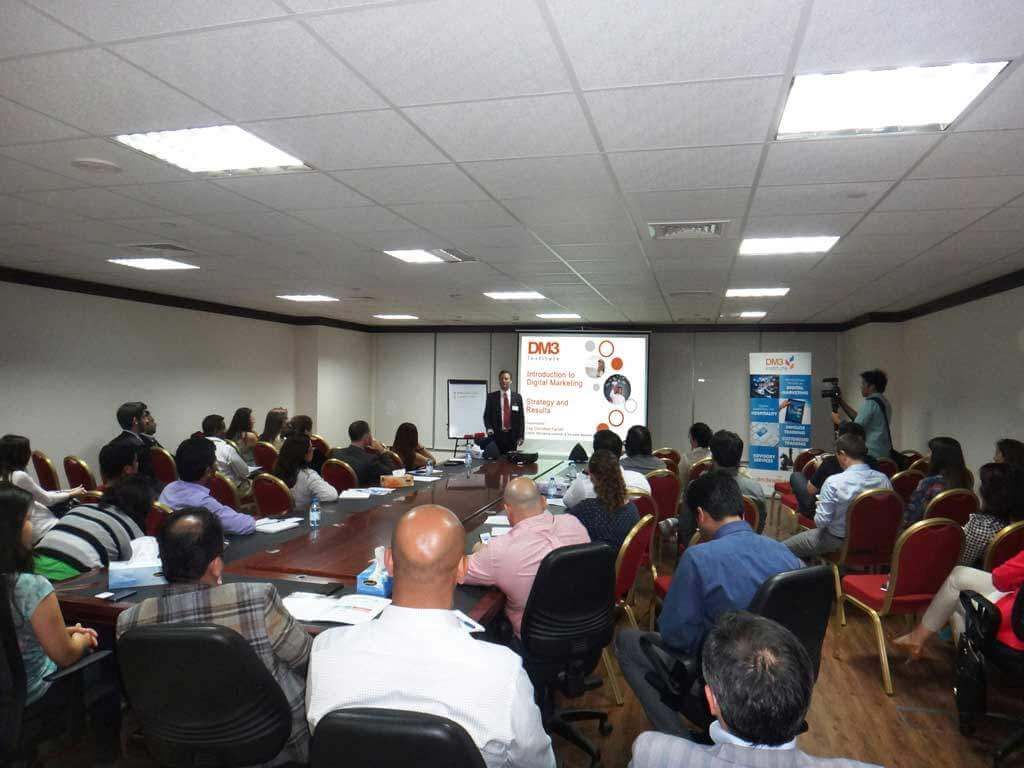Prof. Christian Farioli delivering a digital marketing workshop to a seated audience